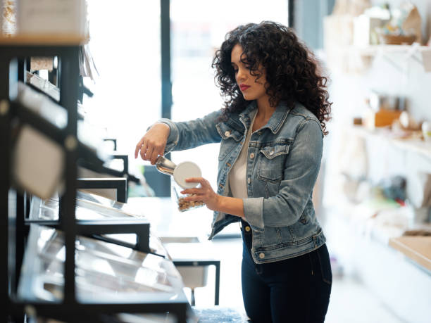 istock Latin woman self-serving in zero waste store 1202789121