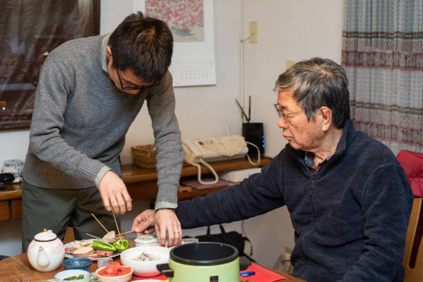 istock A man and his elderly father preparing dinner 1202791388