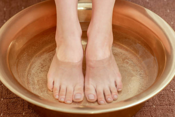 istock Female feet care in bowl. 1202791417