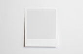 Blank polaroid photo frame with soft shadows isolated on white paper background as template for graphic designers presentations, portfolios etc.