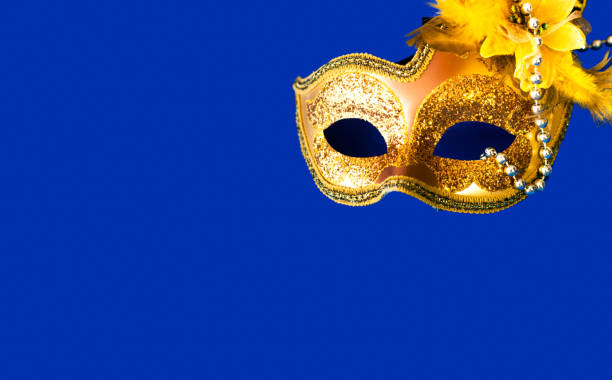 istock Carnival mask on blue background with silver beads. Mardi Gras concept. Copy space 1202792452
