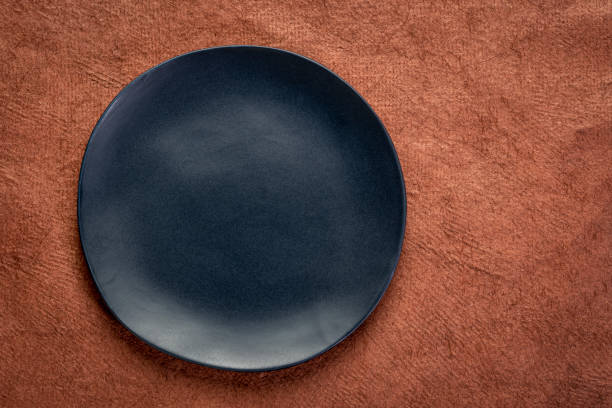 istock black plate on textured handmade paper 1202792480