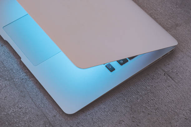 istock Top view of a laptop with closed lid on an office table. 1202792589