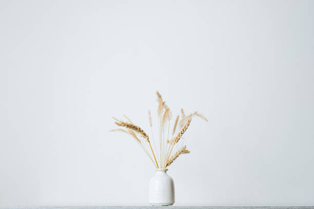 istock Spikelets or wheat in a vase on the table. 1202792695