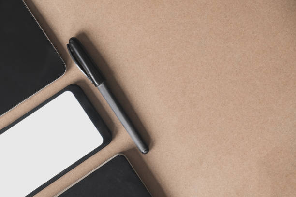 istock Business flat lay on brown paper background. 1202792770