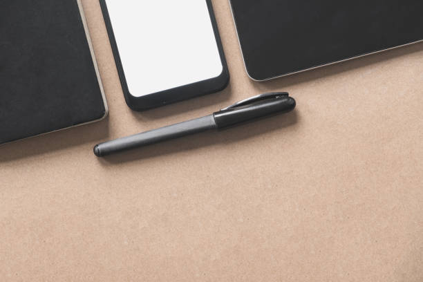 istock Business flat lay on brown paper background. 1202792802