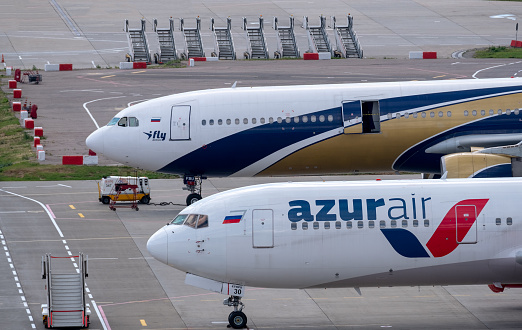 July 2, 2019, Moscow, Russia. Airplanes Boeing 767-300 Azur Air airline and Airbus A330-300 I Fly Airlines at Vnukovo airport in Moscow.