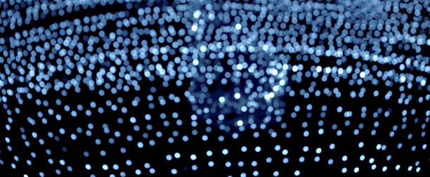 istock Colorful circles of light abstract background. Holiday texture. Glitter multicolored light spots on gray backdrop. Banner, lens. 1202793900