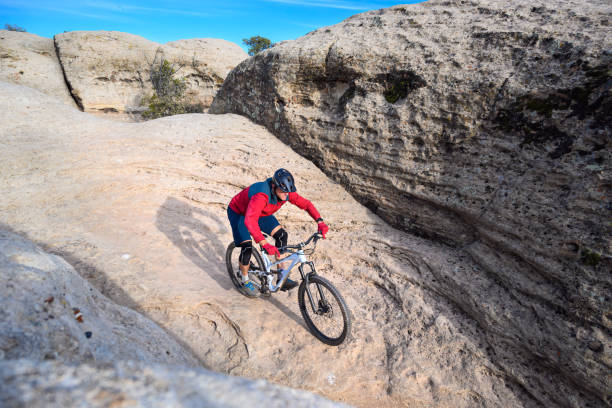istock Mountain Biker Riding Through Boulders in The Southwest Desert 1202794372