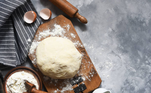 istock Ingridintny for baking: dough, flour, milk. Cooking process. 1202794394
