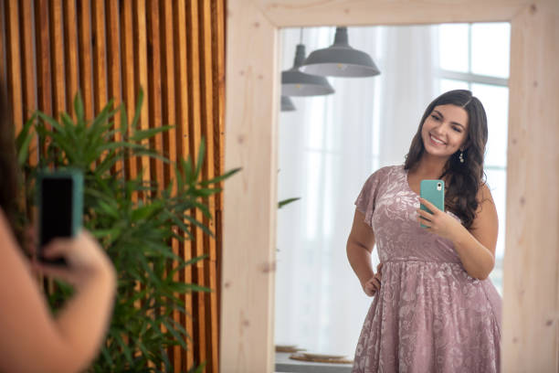 istock Young plus-size woman making selfie and feeling wonderful 1202795197