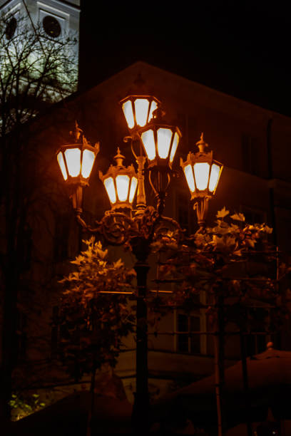 istock Vintage luminous street lantern at night 1202796020