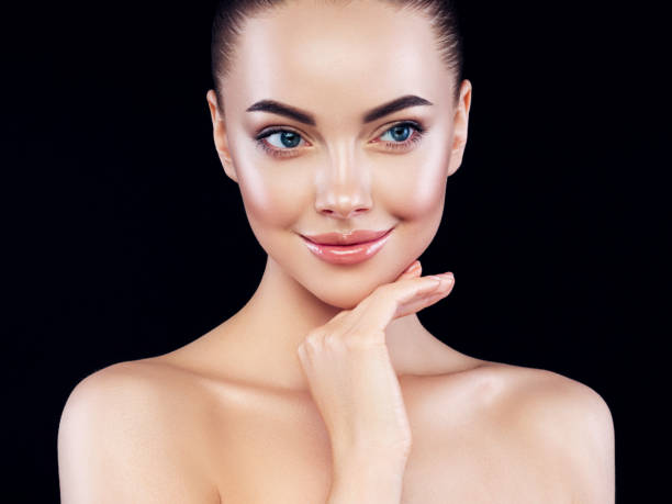 istock Beautiful girl on black background 1202796860