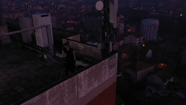 Man smoking the cigarette on the rooftop