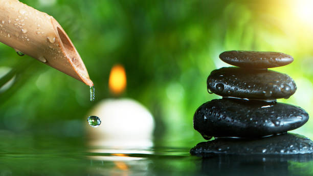 istock Dripping drops from bamboo tube 1202799734