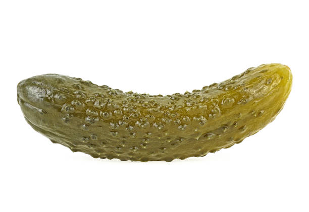 istock Marinated cucumber isolated on a white background.  Gherkin. Salted cornichon. 1202800945
