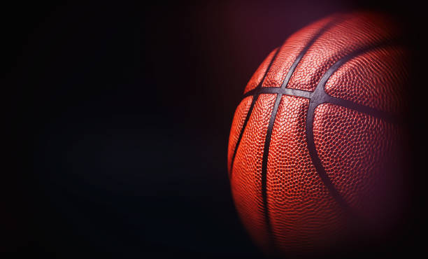 basketballball auf schwarzem hintergrund. - basketball nobody sporting ball stock-fotos und bilder