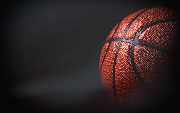 istock basketball ball on black background. 1202801782