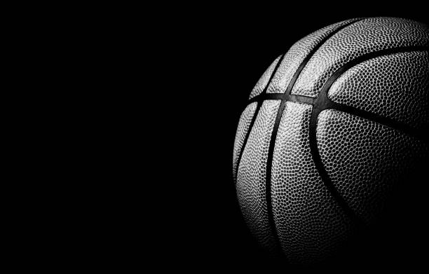 istock basketball ball on black background. 1202801789
