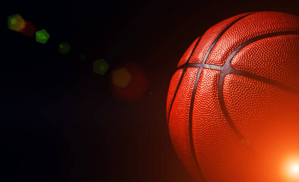 istock basketball ball on black background. 1202802296
