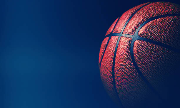 istock basketball ball on black background. 1202802374