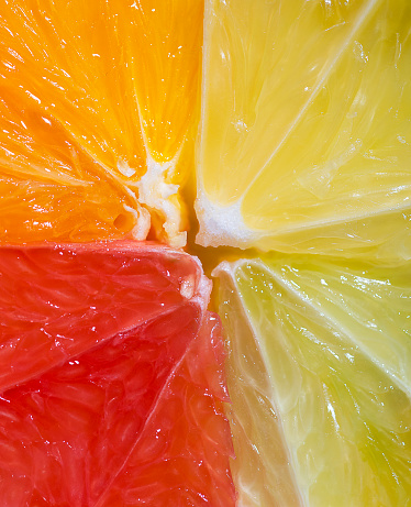 Slice of lime in the water with bubbles close up.