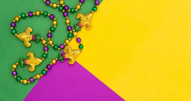Photo of Mardi gras decoration beads Colorful background