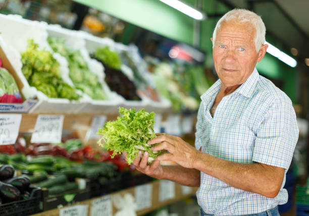 istock Senior man shopping in greengrocery 1202803183