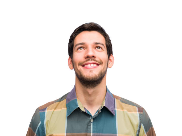 istock Portrait of real hispanic man with happy expression looking up 1202805672