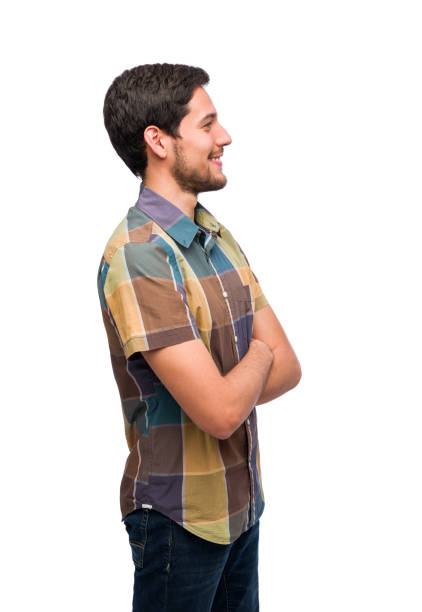 istock Side view of young guy in jean smiling 1202805693