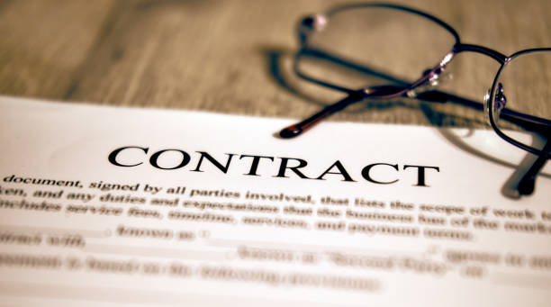 istock White paper and pen, contract template on the table 1202807279