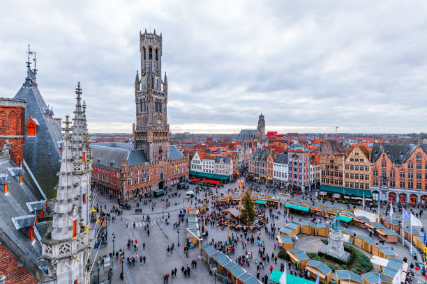 Cityscape of Bruges Cityscape and main square in Bruges (Belgium), Belfry Tower market square stock pictures, royalty-free photos & images