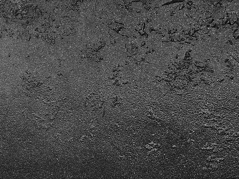 Gray texture of wet asphalt on the road, wet asphalt texture