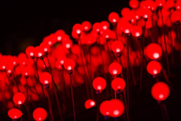 istock Bright garlands of multi colored lanterns at night 1202809849