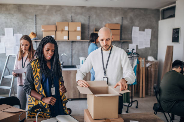 istock Diverse group of people arranging customers orders for drop shipping 1202812944