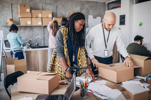 istock Diverse group of people arranging customers orders for drop shipping 1202812996