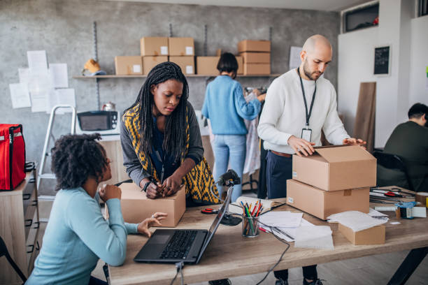 istock Diverse group of people arranging customers orders for drop shipping 1202813026