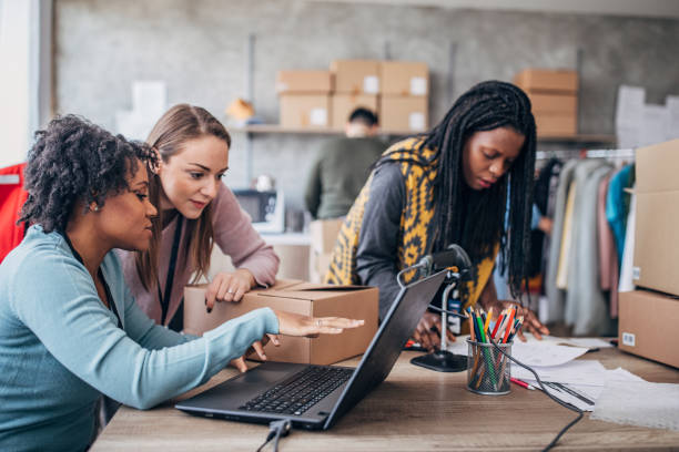 istock Diverse group of people arranging customers orders for drop shipping 1202813126