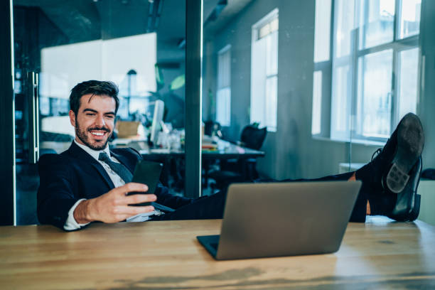 istock Businessman texting on mobile phone in the office. 1202813230