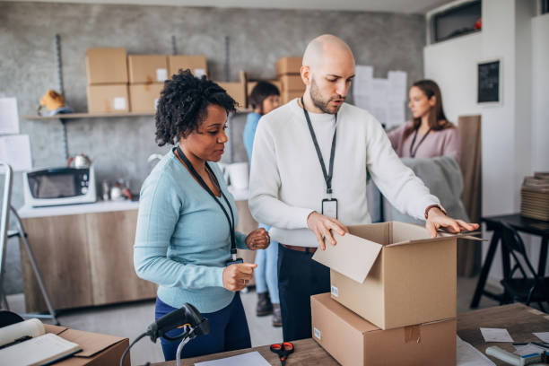 istock Diverse group of people arranging customers orders for drop shipping 1202813439