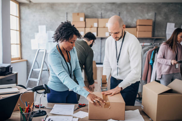 istock Diverse group of people arranging customers orders for drop shipping 1202813517