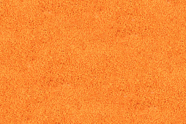 красная чечевица на белом - lentil full frame macro close up стоковые фото и изображения