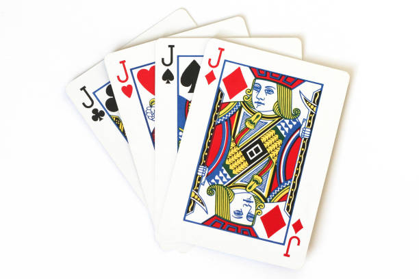 istock Four Jacks of different suits on playing cards, close up on a white background 1202815892