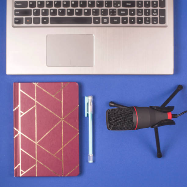 istock Microphone and notepad for recording podcast. Blogger desktop. 1202818557