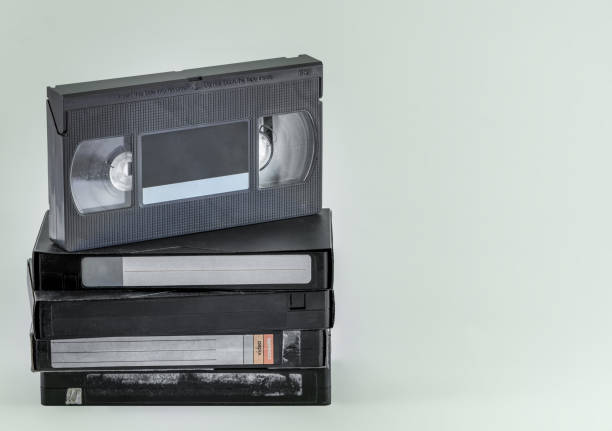 istock Stacked VHS tapes, isolated. Old VHS video cassettes with copy space. Outdated technology. Highly popular old video technology from 80s and 90s. 1202819887