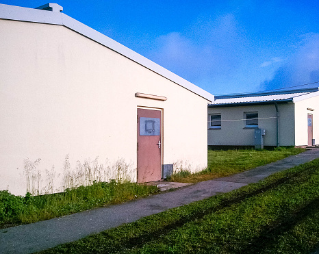 An old style of military accommodation, also known as a 'billet' usually basic, cold and filled with many bunk beds.