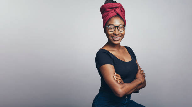 istock Smiling african woman in a headwrap 1202825033