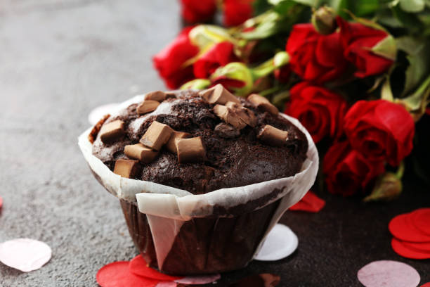 Pictured muffin in a basket with dried flower.