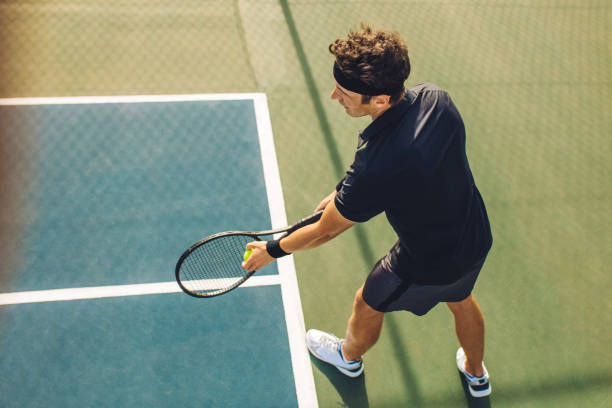 istock Tennis player with racket ready to serve 1202825154
