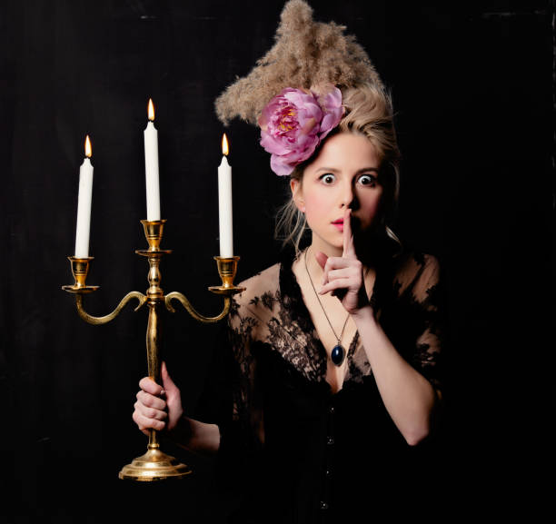istock Beautiful blonde countess with a candlestick 1202826370